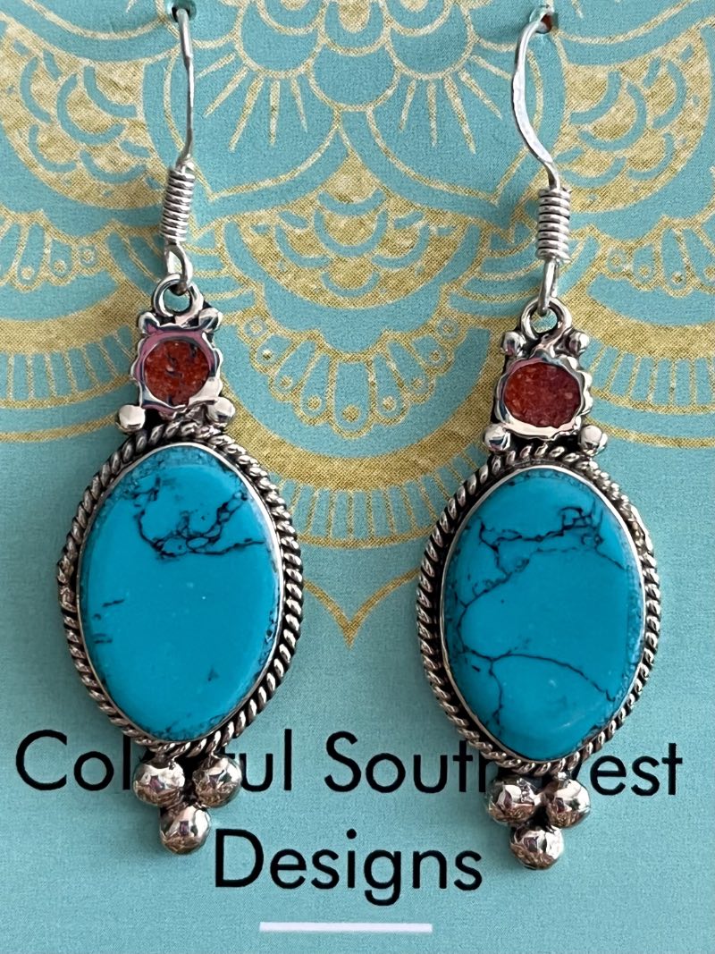Turquoise earrings with small coral accent